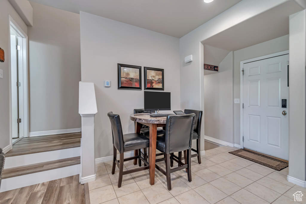 Dining room with recessed lighting and light tile patterned flooring