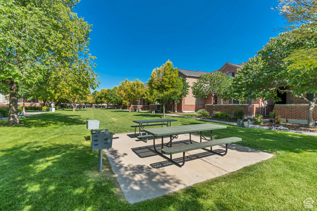 View of home\'s community with a lawn