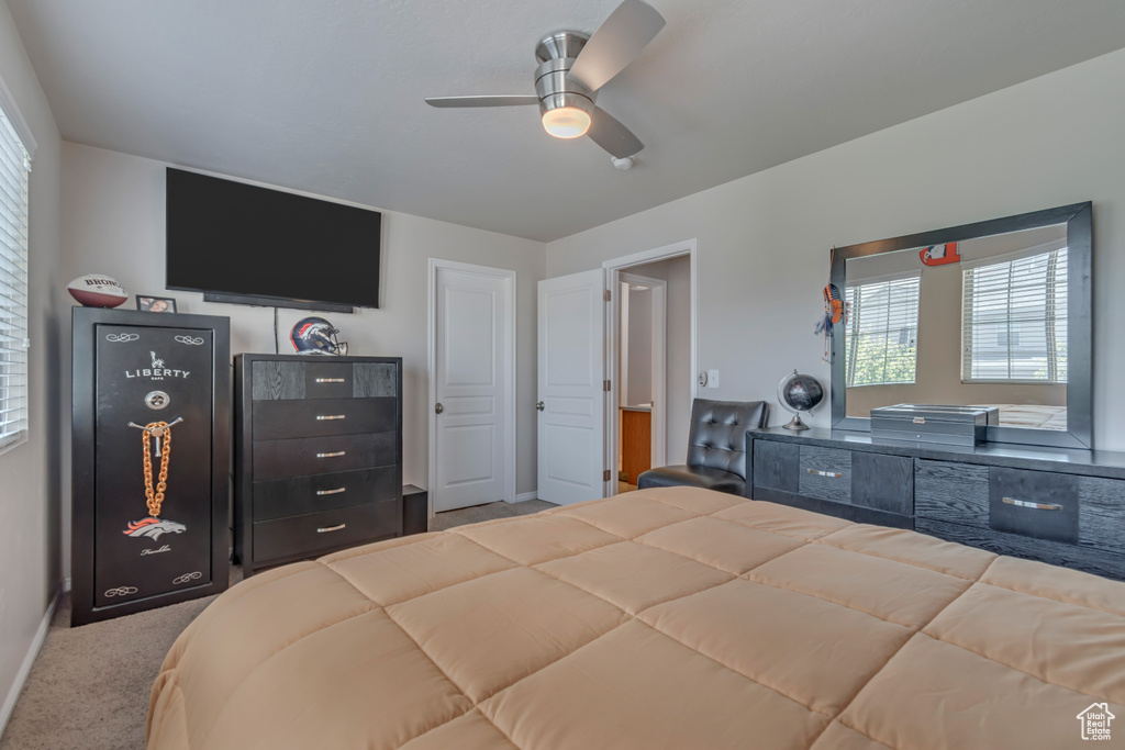Bedroom with carpet and ceiling fan