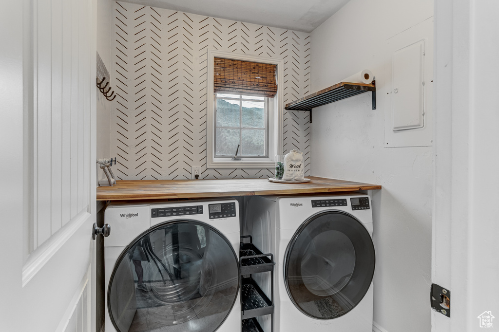 Washroom featuring washer and dryer and electric panel
