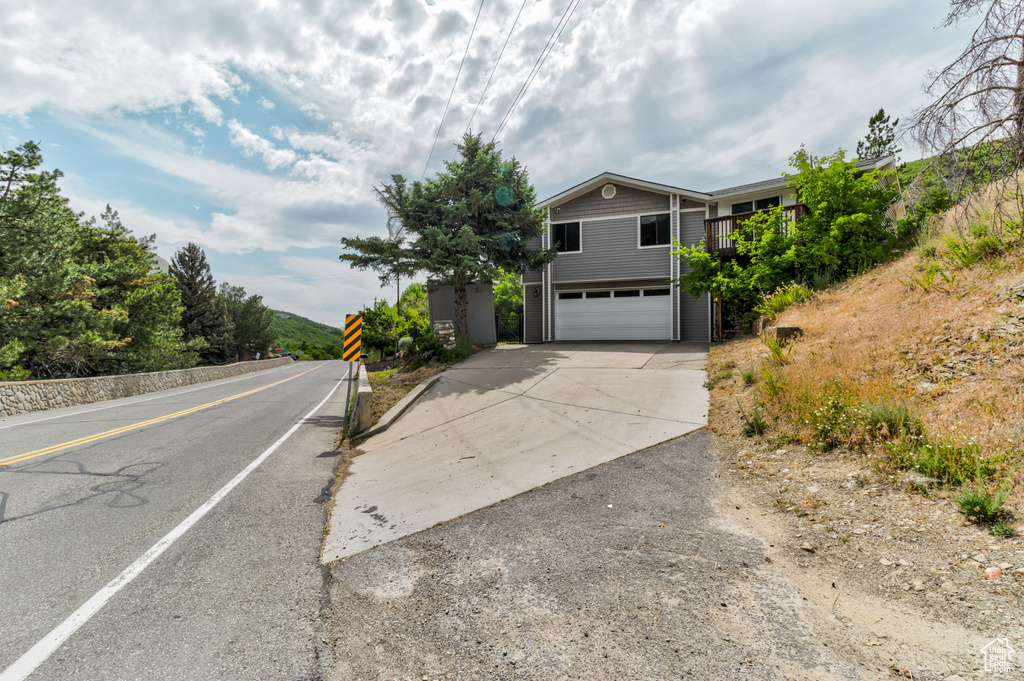 View of front of property with an attached garage and driveway