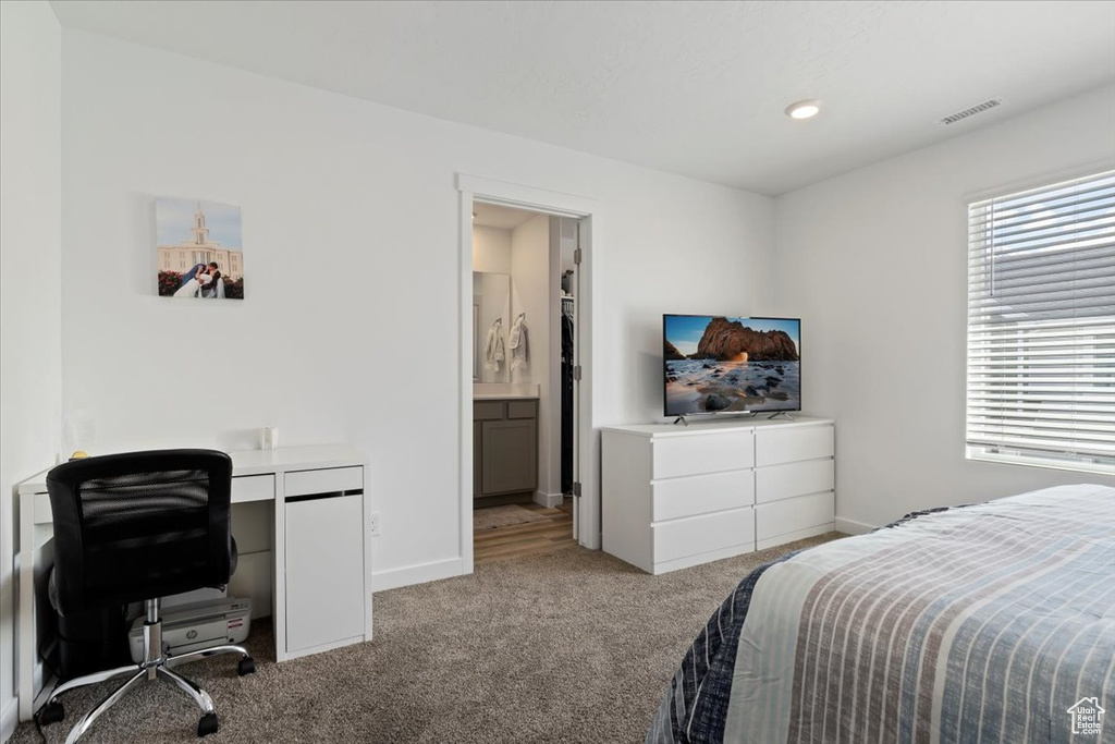 Bedroom with carpet floors, a desk, and recessed lighting