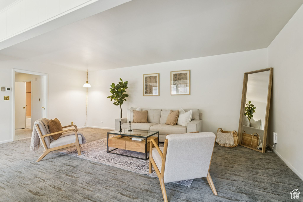 Living area with carpet and baseboards