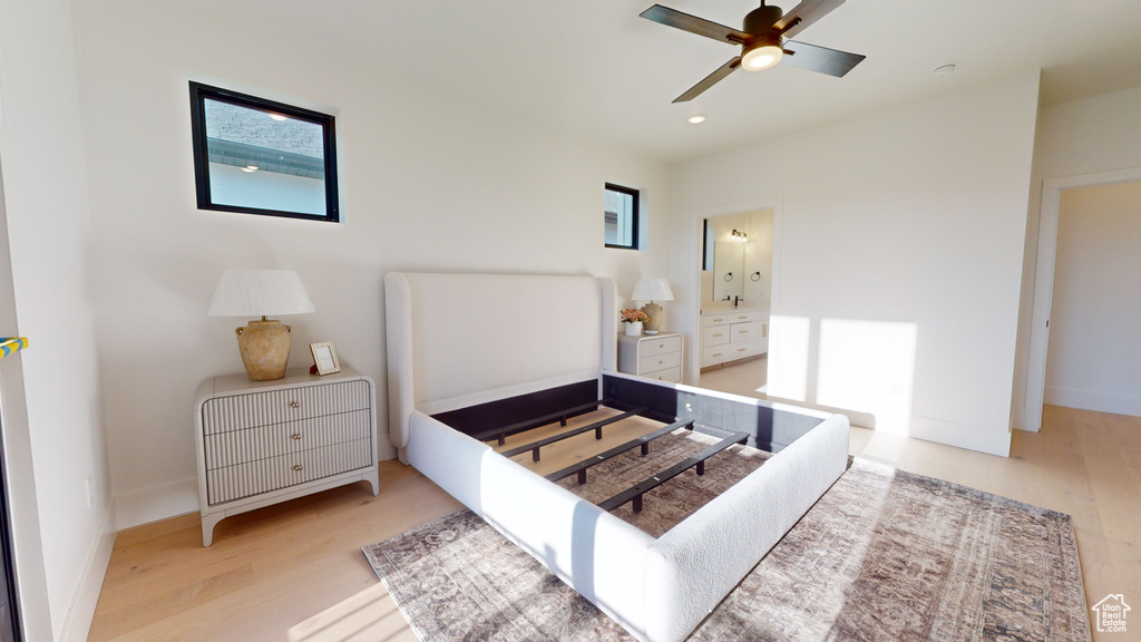 Bedroom featuring wood finished floors, recessed lighting, ceiling fan, and ensuite bath
