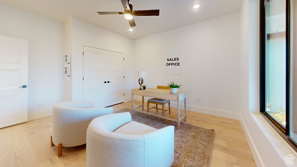 Office with light wood finished floors, a ceiling fan, and recessed lighting