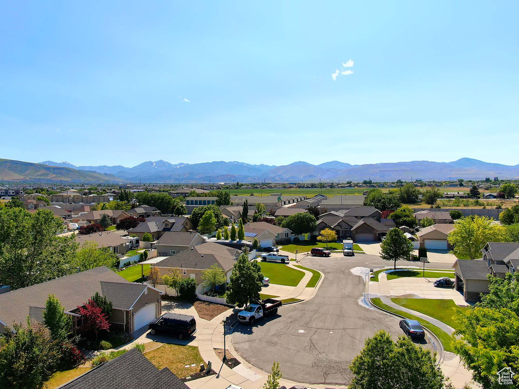 Aerial perspective of suburban area with a mountain backdrop