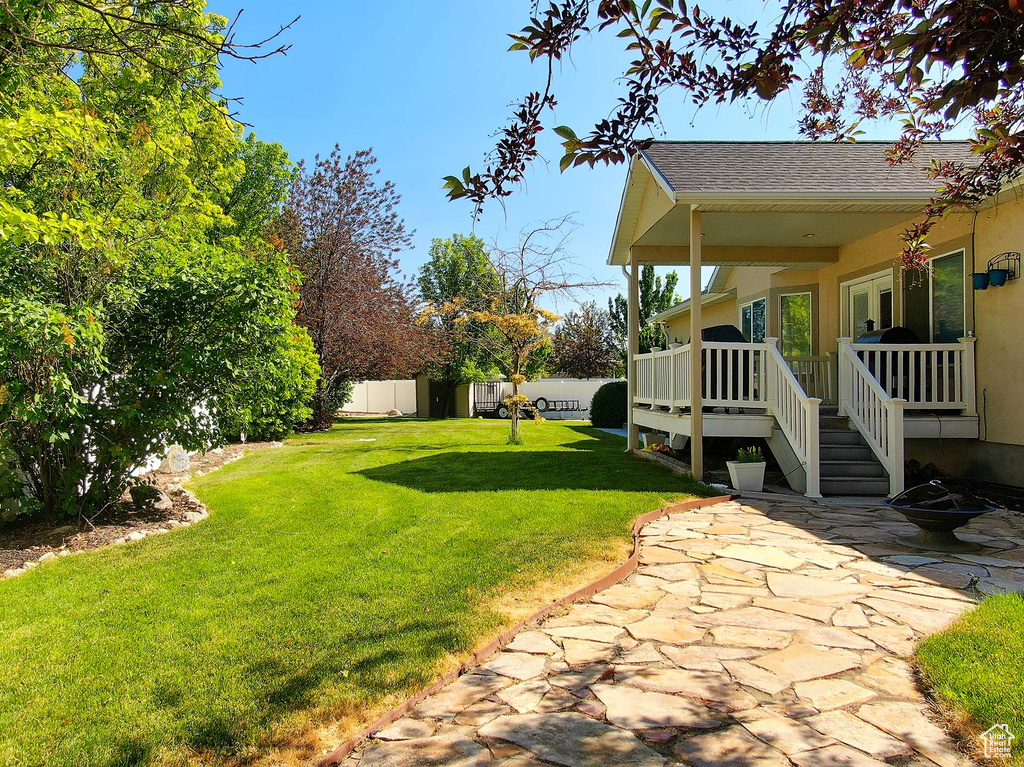 View of yard with a patio
