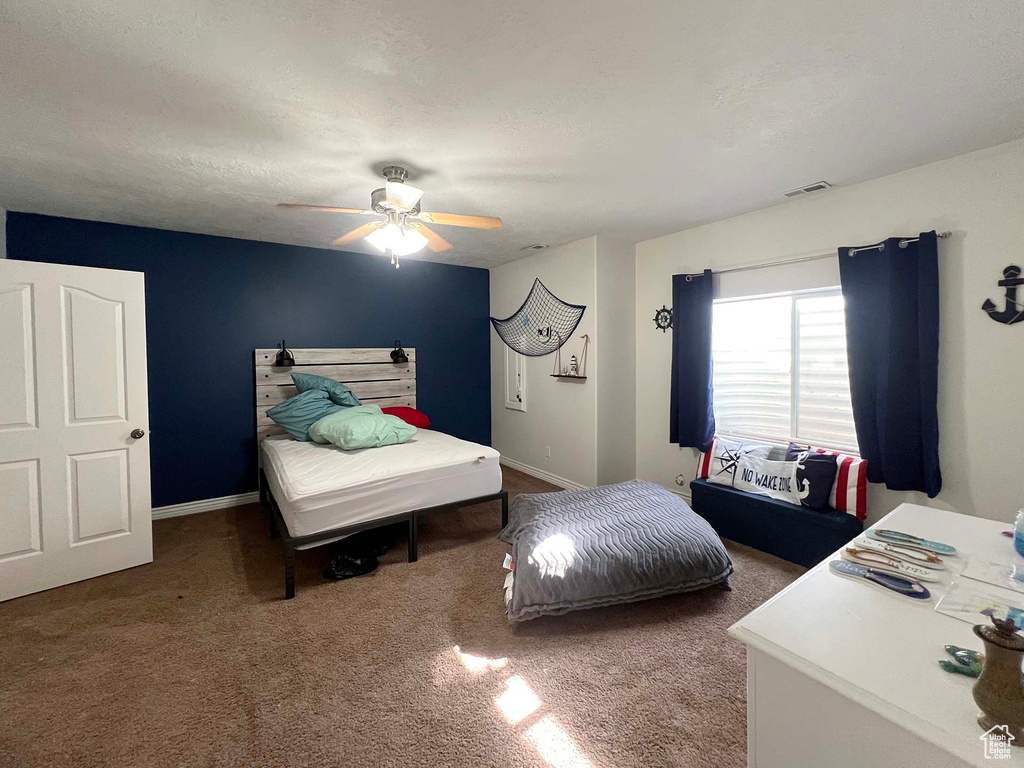 Bedroom with carpet floors and ceiling fan