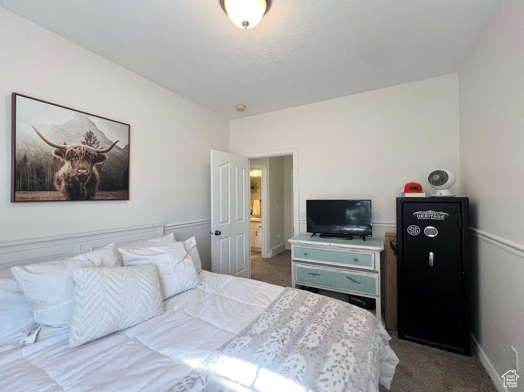 Carpeted bedroom with baseboards
