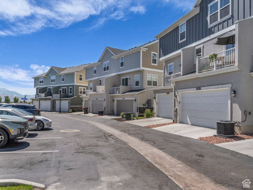 View of asphalt street featuring a residential view and a mountain view