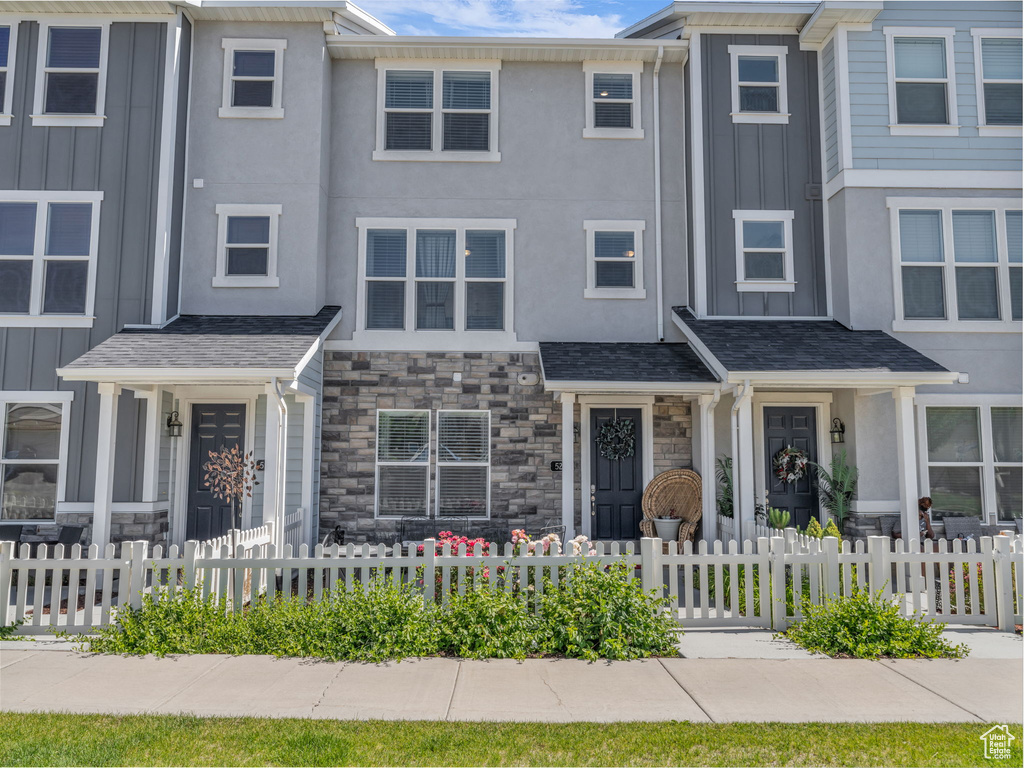 Multi unit property with stone siding, board and batten siding, and stucco siding