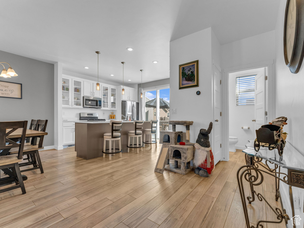 Living room featuring light wood-style floors and recessed lighting