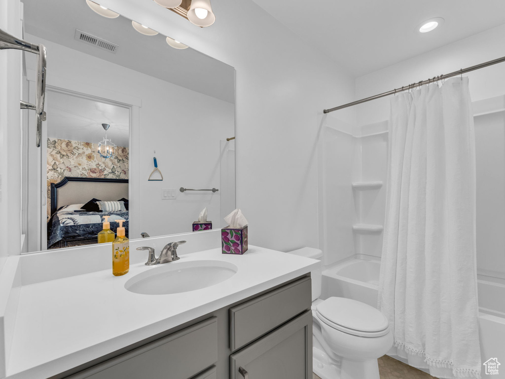 Full bathroom featuring vanity, shower / tub combo with curtain, connected bathroom, and recessed lighting