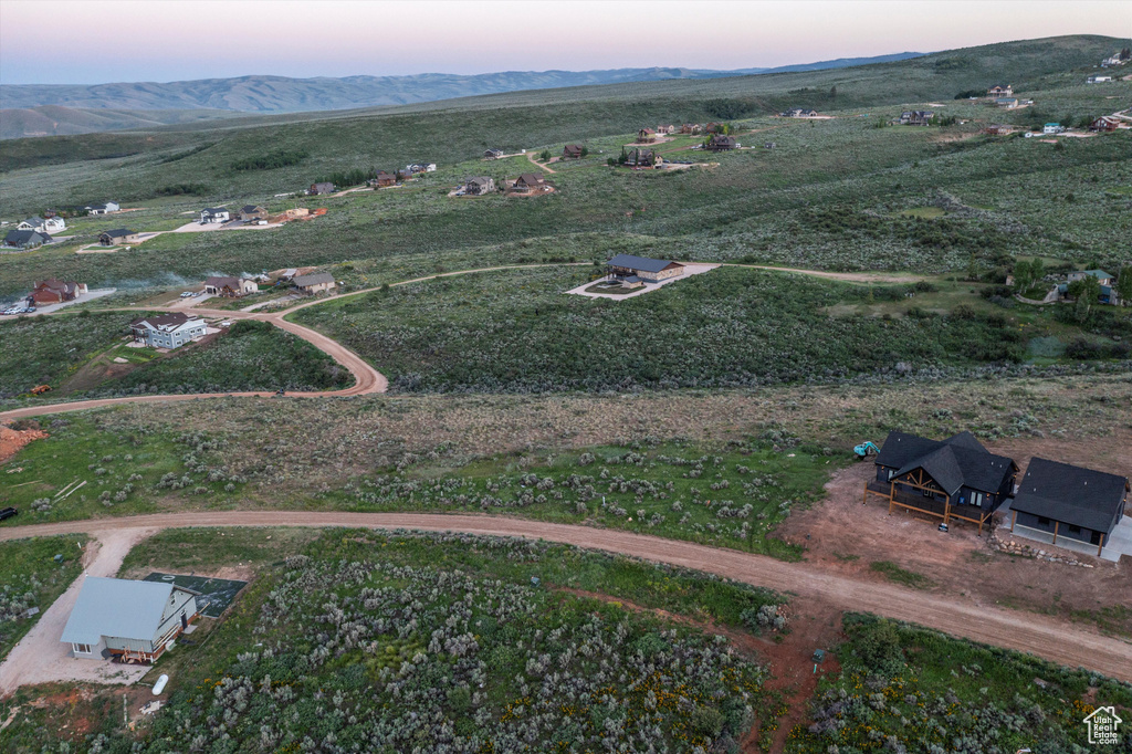 Aerial view at dusk of a mountain view and a rural view
