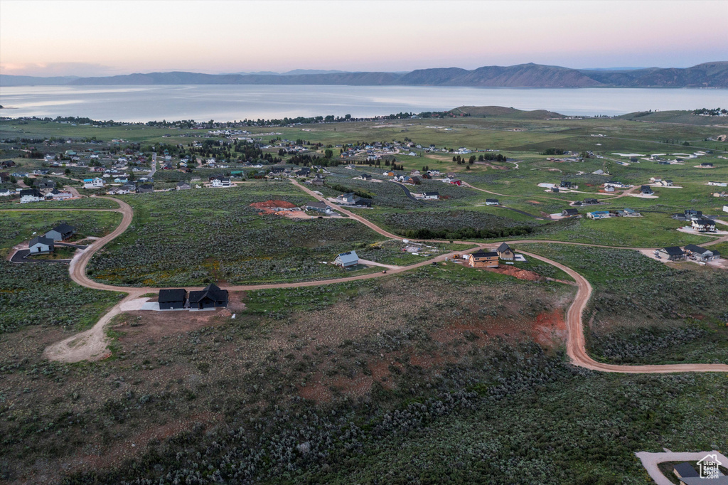 Aerial view at dusk of a water and mountain view