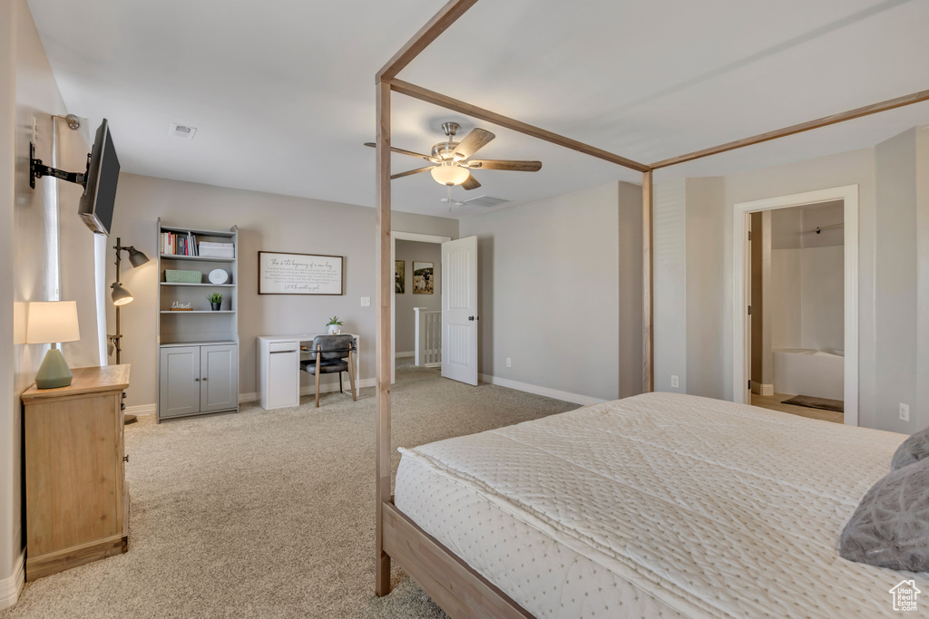 Carpeted bedroom with baseboards and ceiling fan