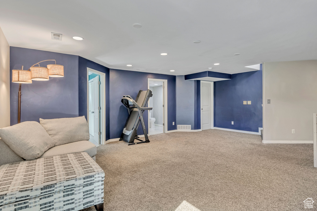 Sitting room with carpet flooring and recessed lighting