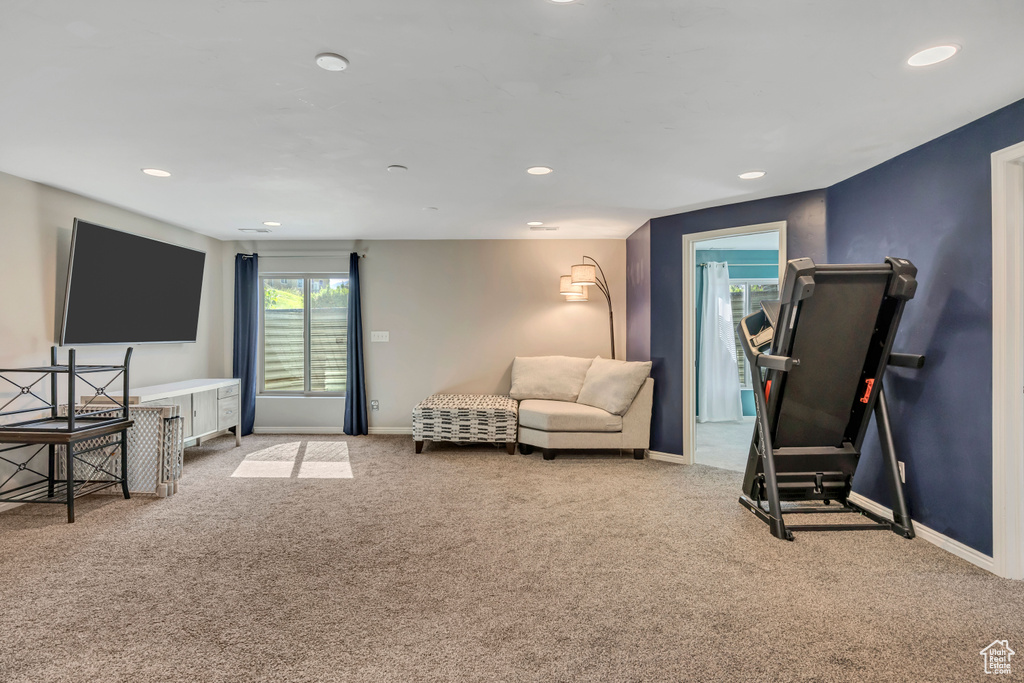 Workout area with carpet floors and recessed lighting