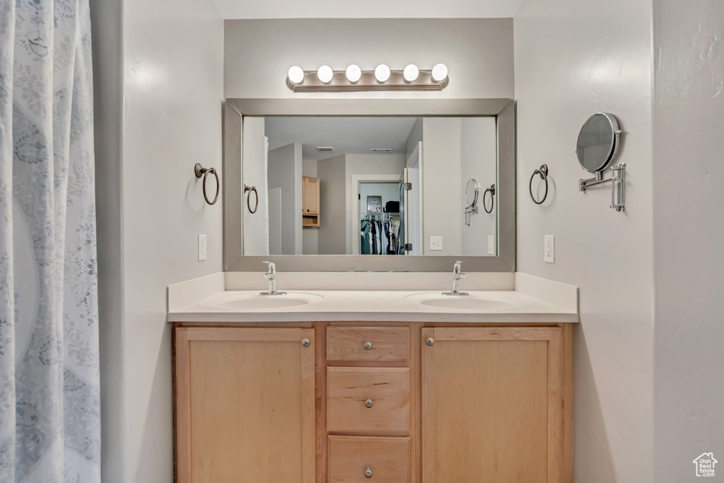 Full bathroom featuring double vanity