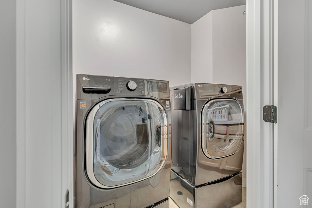 Laundry area with washing machine and clothes dryer