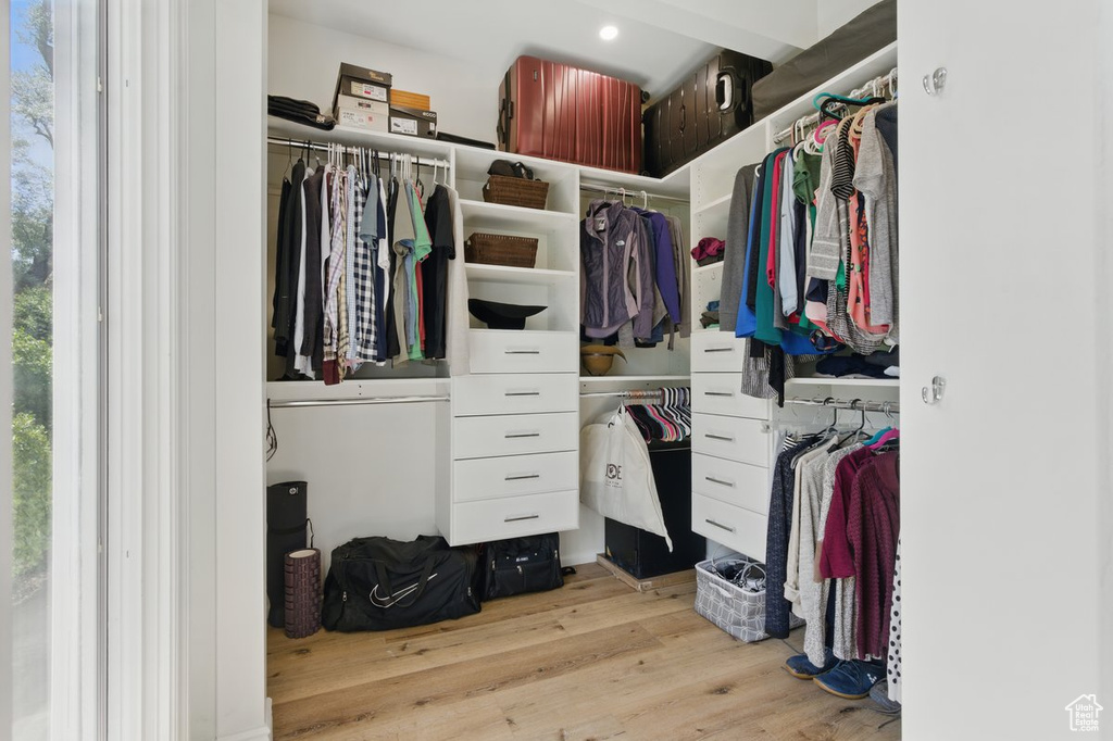 Spacious closet with wood finished floors