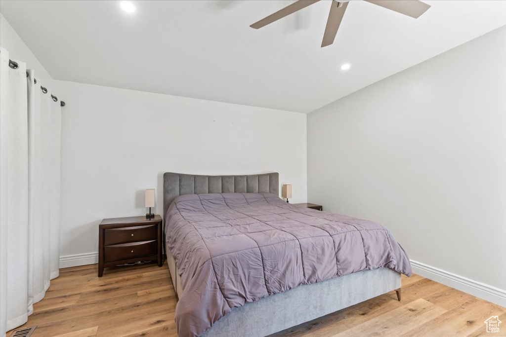 Bedroom featuring wood finished floors, recessed lighting, and ceiling fan
