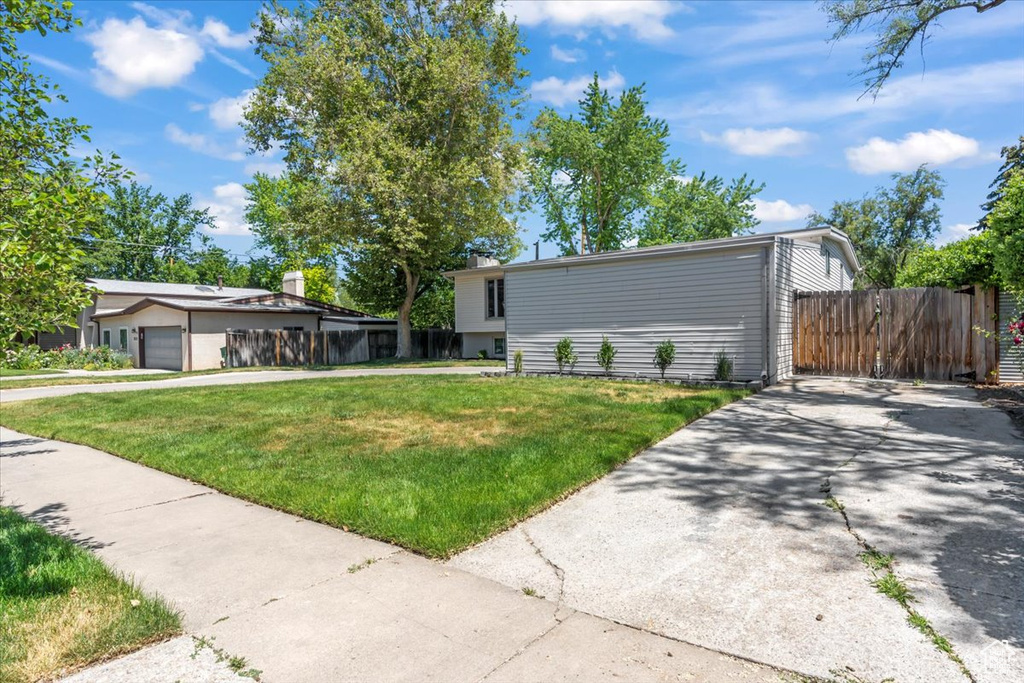 View of front facade with driveway and a garage