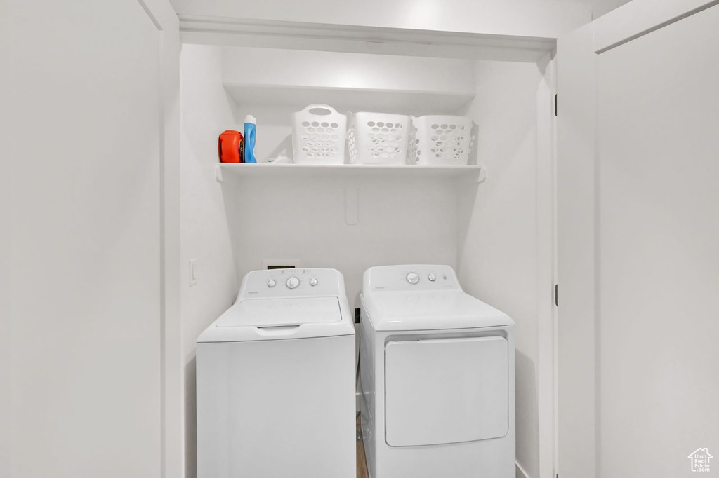 Washroom featuring washing machine and dryer