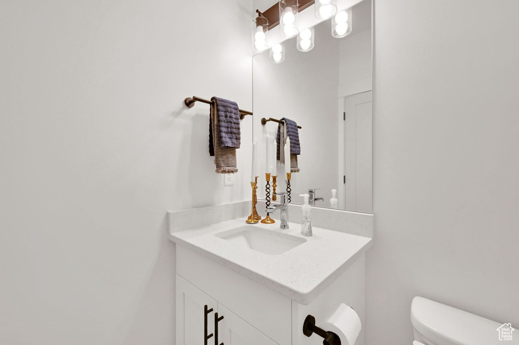 Half bath with vanity and toilet