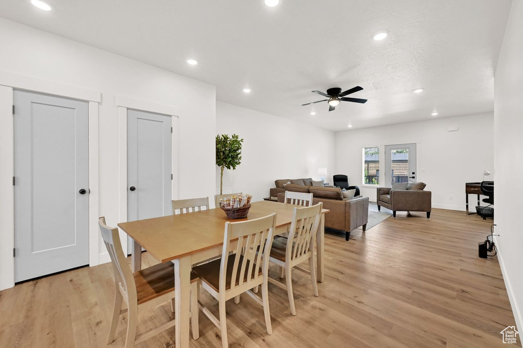 Dining space with light wood-style flooring, recessed lighting, and ceiling fan