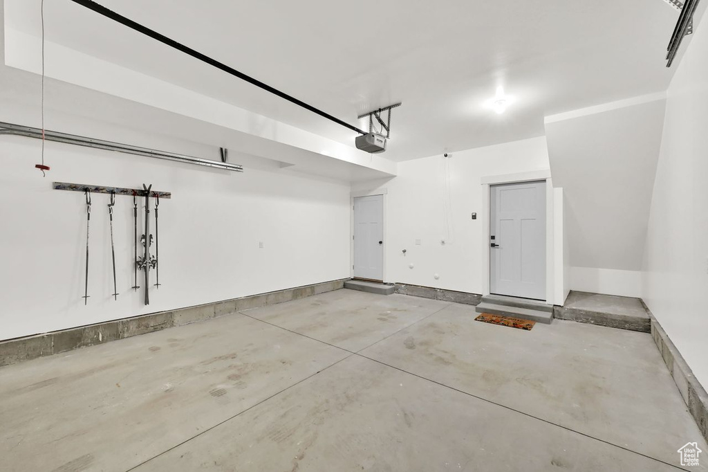 Garage featuring a garage door opener