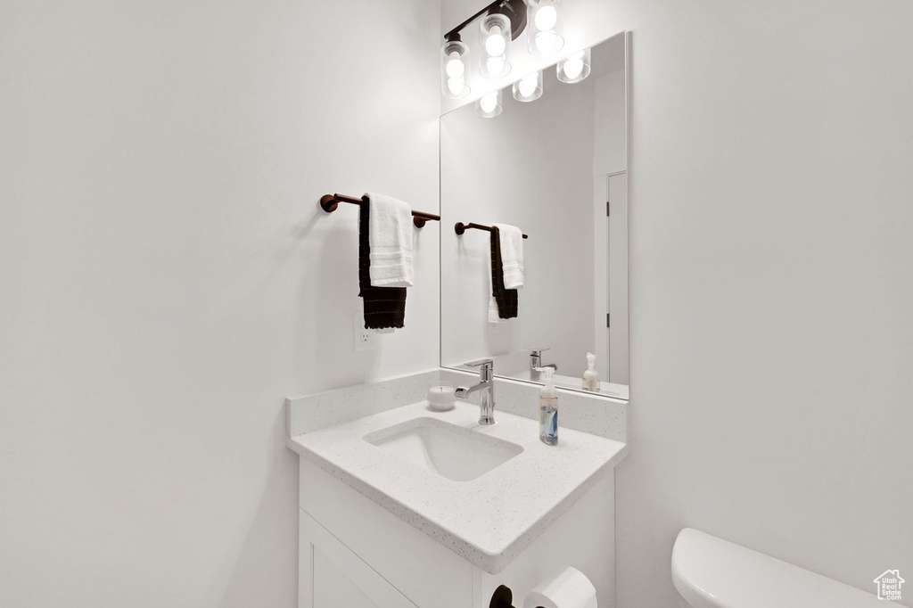 Bathroom featuring vanity and toilet