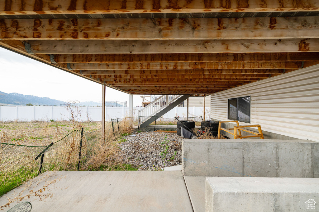 View of patio featuring a mountain view and stairway
