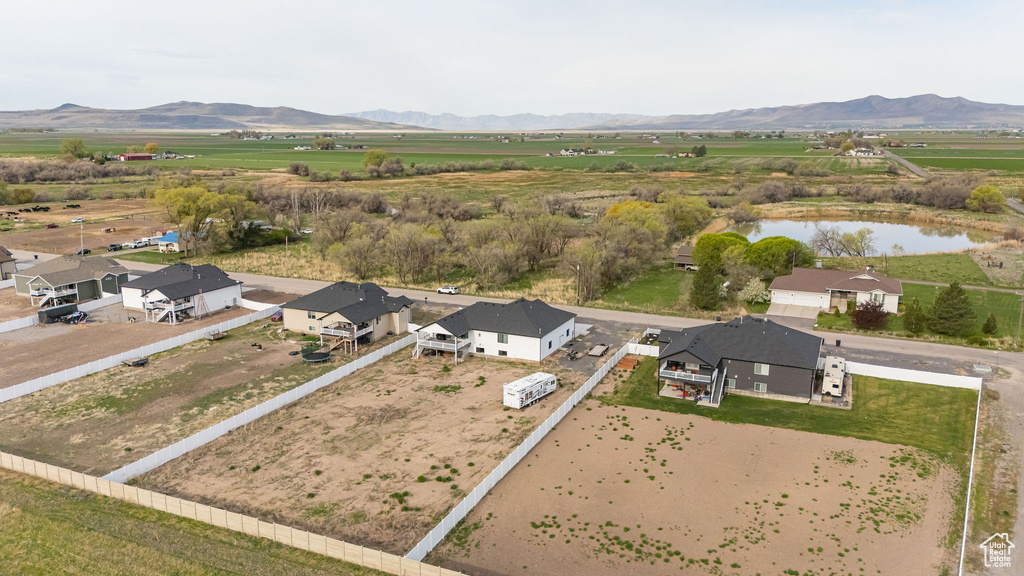 Overview of rural landscape featuring a water and mountain view