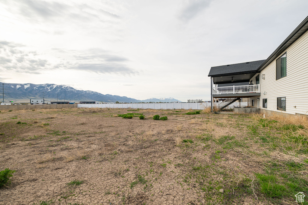 View of yard with a mountain view and stairs