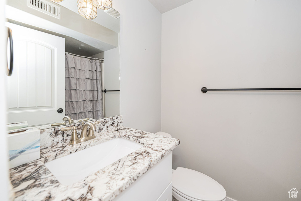 Bathroom featuring toilet and vanity