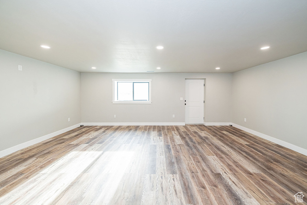 Empty room featuring wood finished floors and recessed lighting