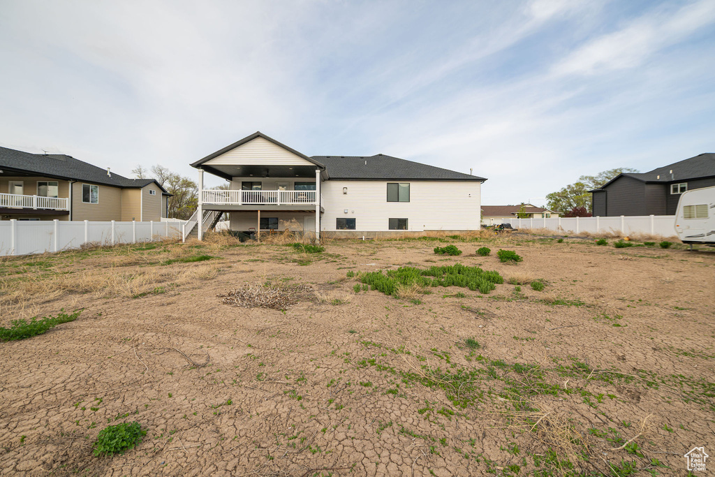 Back of house featuring stairway