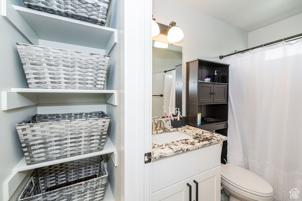 Bathroom featuring vanity and curtained shower