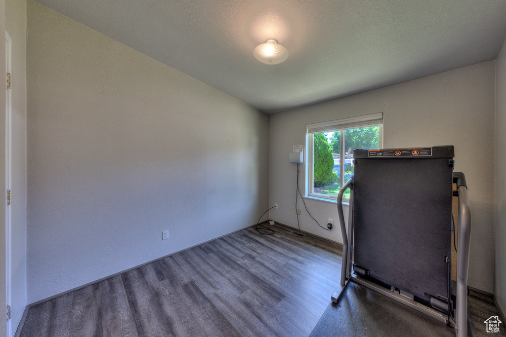 Exercise area featuring wood finished floors