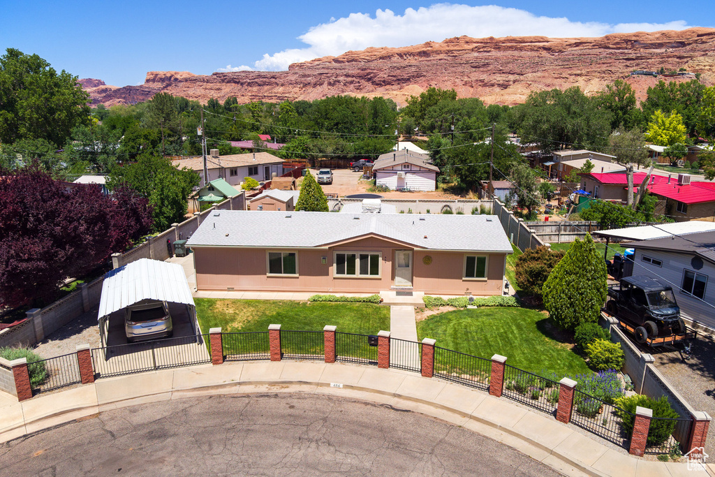 Aerial view of property and surrounding area with a mountainous background
