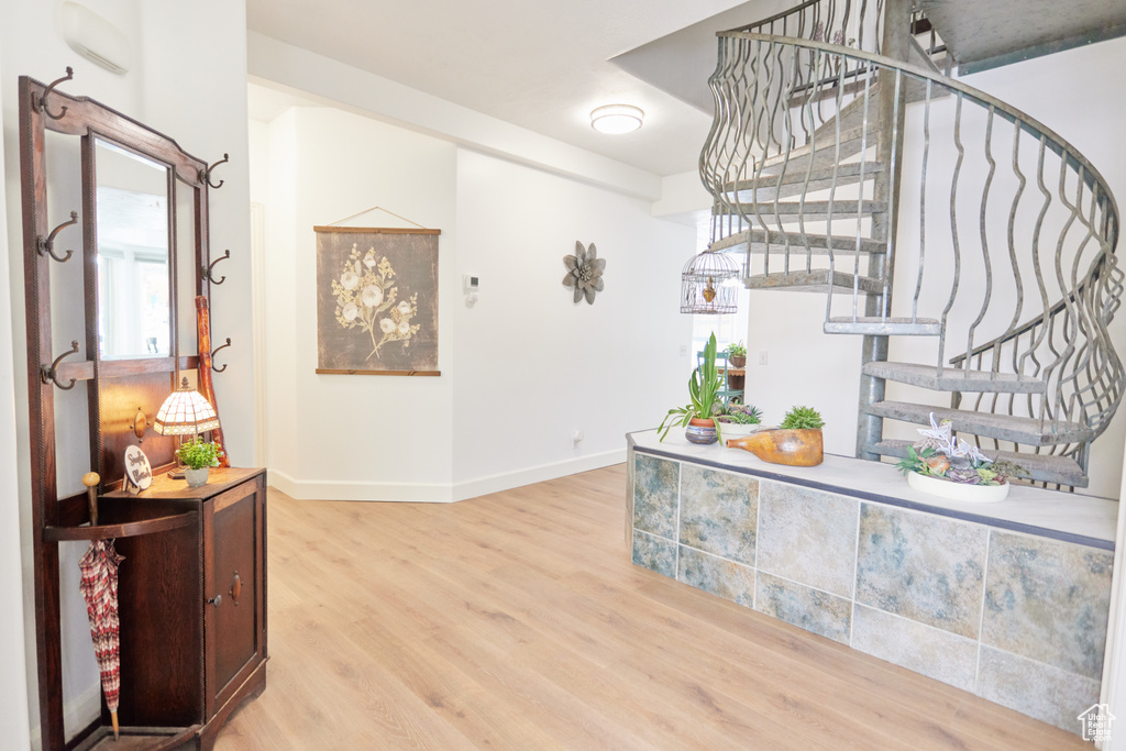 Hall featuring stairway and light wood-style flooring