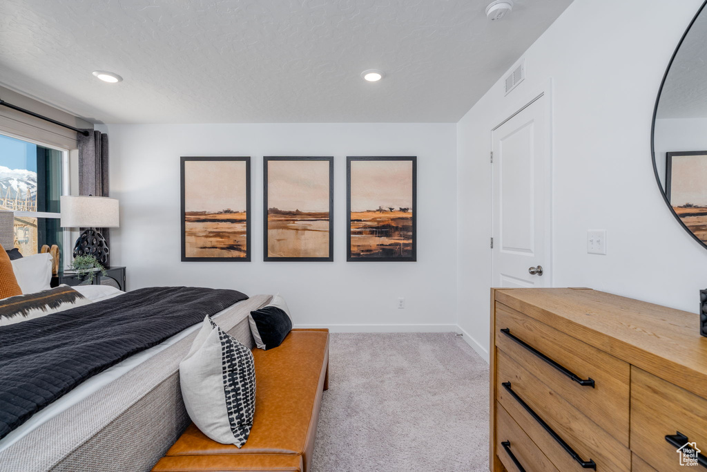 Carpeted bedroom featuring recessed lighting