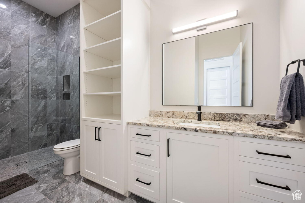 Full bath with walk in shower and vanity