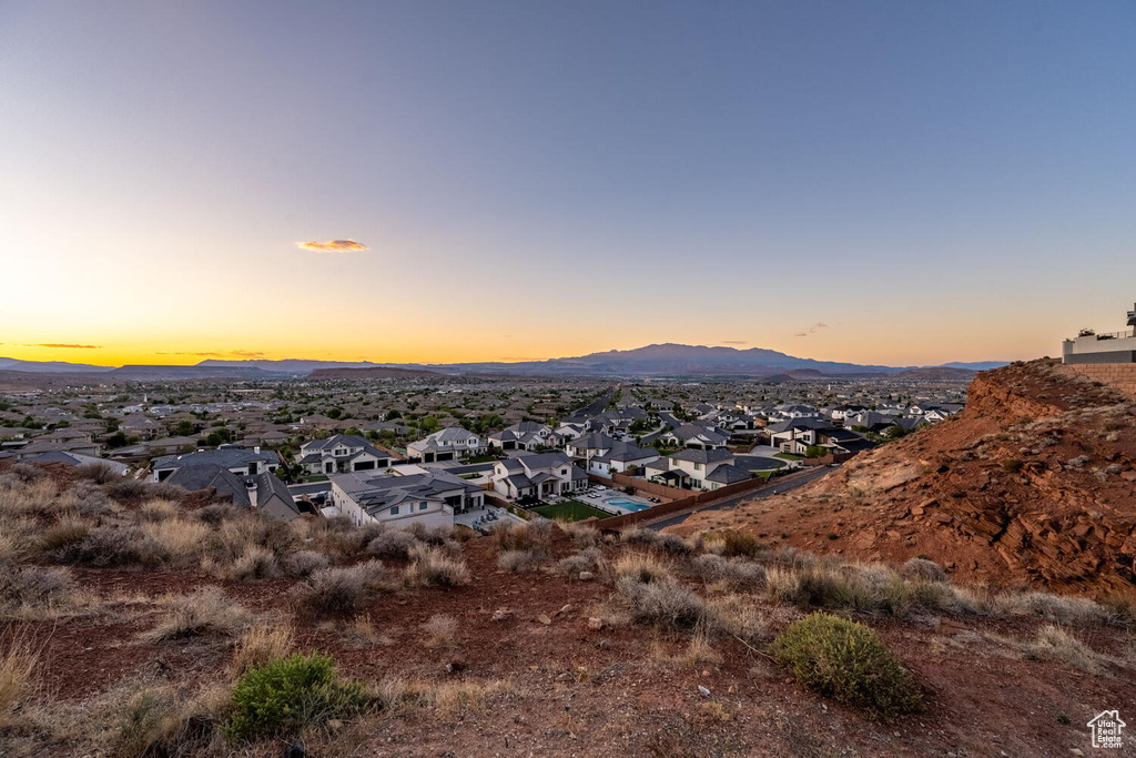 View of mountain backdrop featuring nearby suburban area
