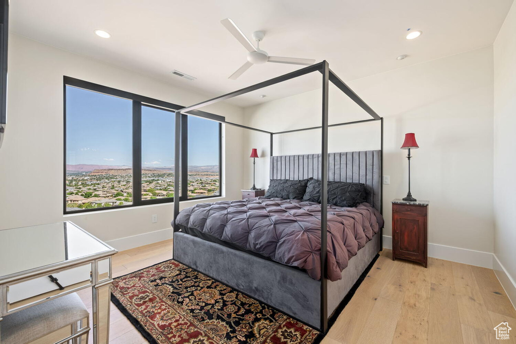 Bedroom with light wood-type flooring, recessed lighting, and ceiling fan