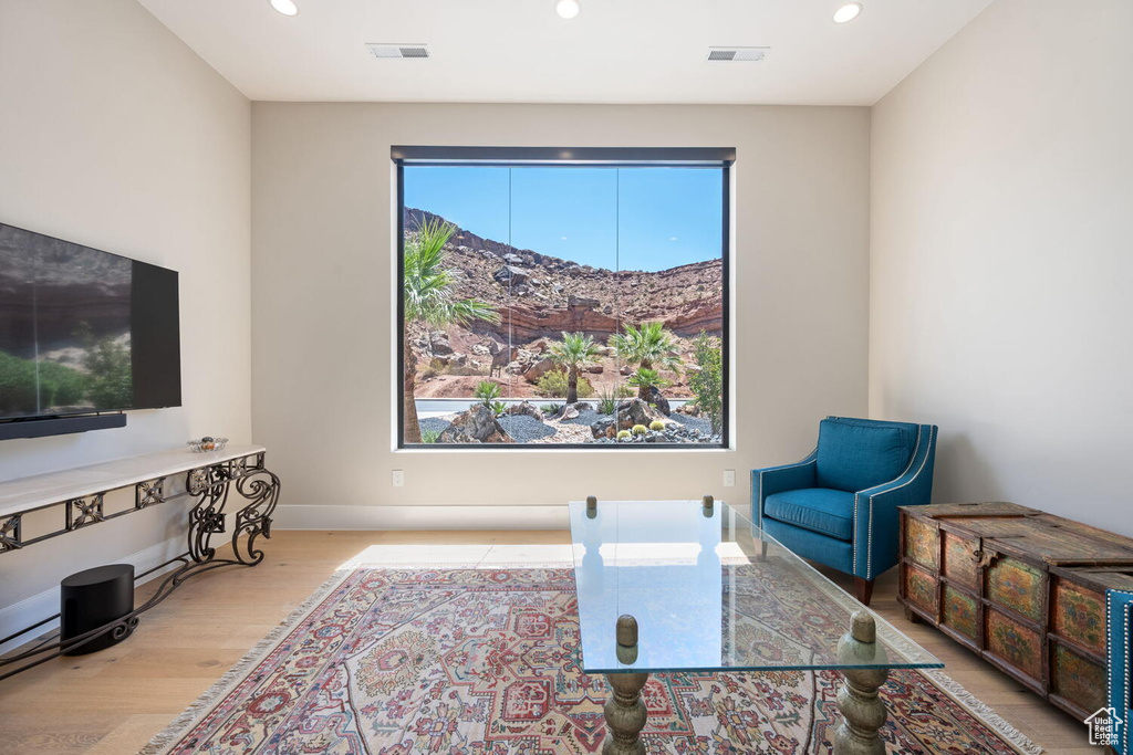 Living area with recessed lighting and wood finished floors