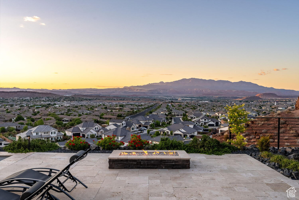 View of mountain backdrop featuring nearby suburban area