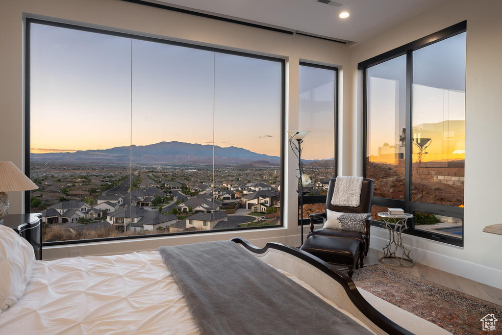 Bedroom featuring a mountain view and wood finished floors