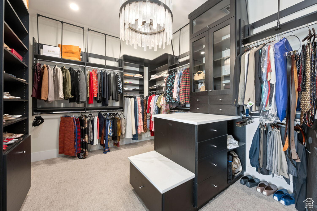 Spacious closet with carpet